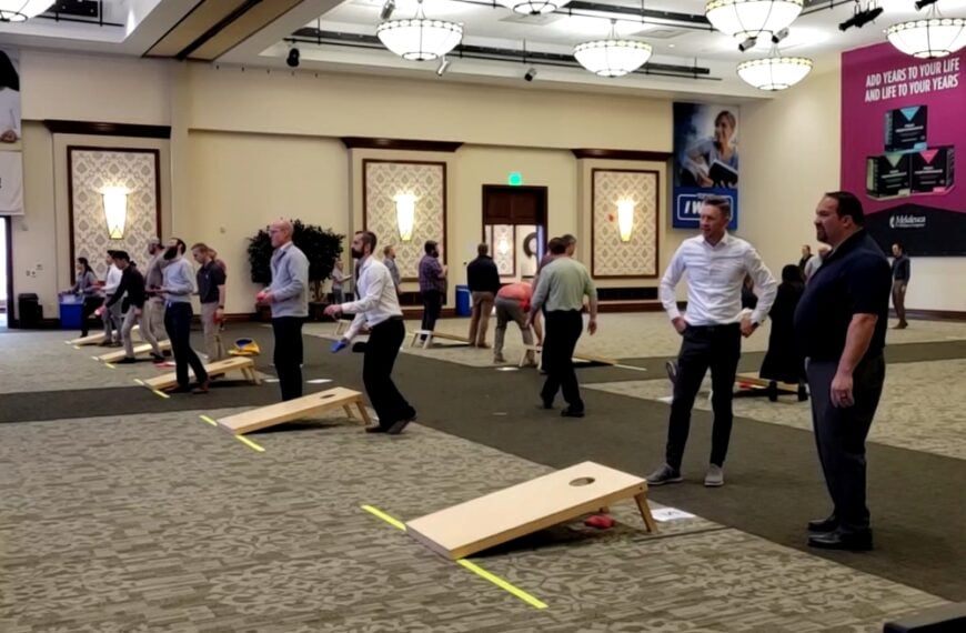 Melaleuca employees playing cornhole